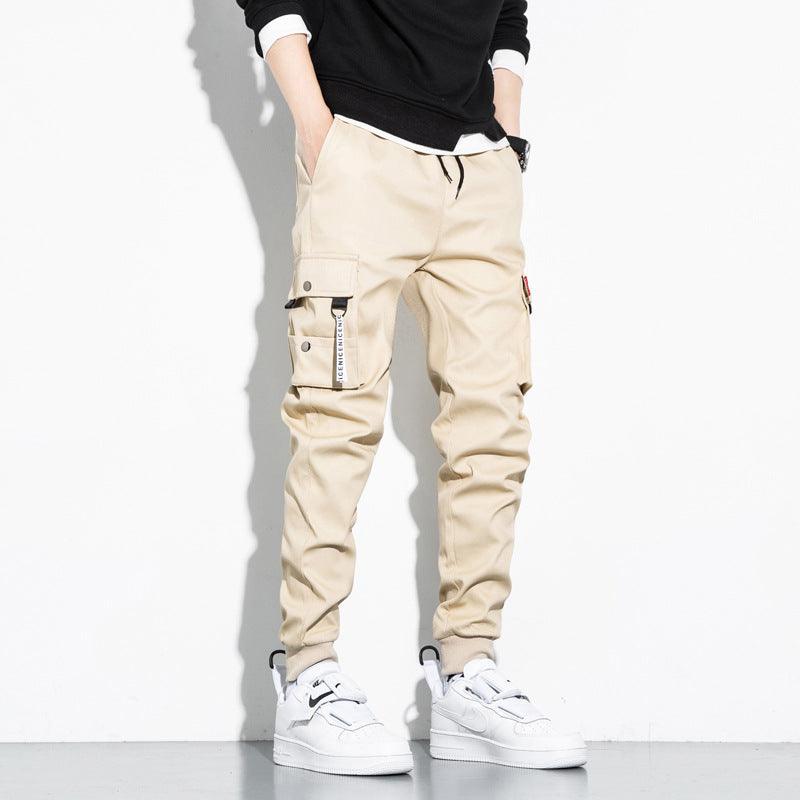 Khaki cotton cargo trousers with multiple utility pockets and adjustable cuffs