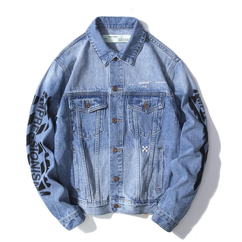 Light blue denim jacket with button front and graffiti arrow lettering on sleeves.