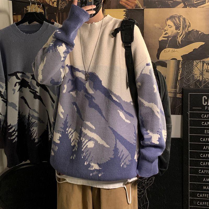 Beige round-neck pullover sweater with blue mountain-and-tree graphic, long sleeves