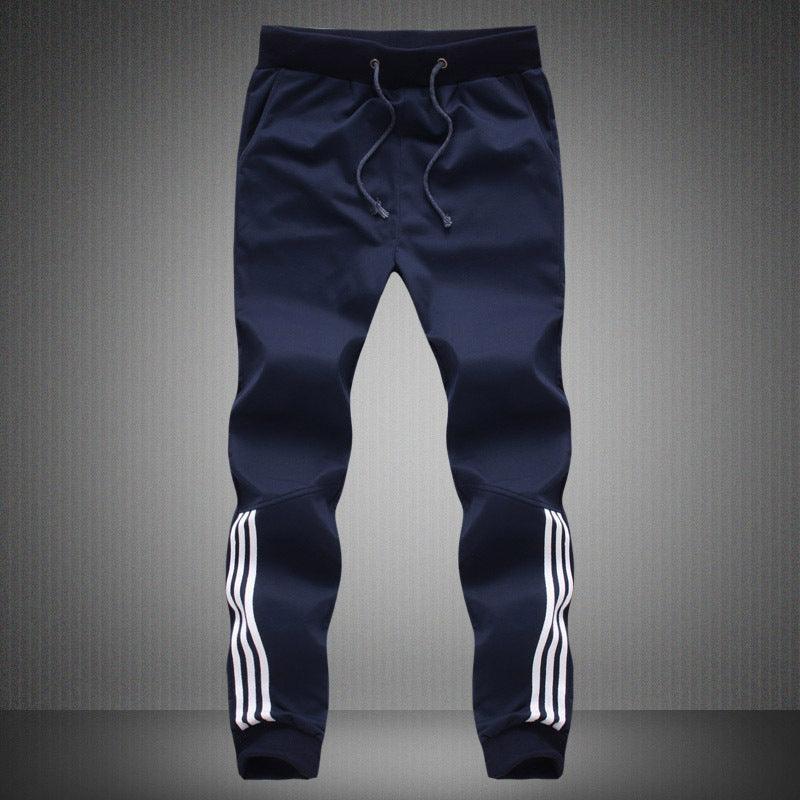Men's navy jogger trousers with white side stripe panels and drawstring waist