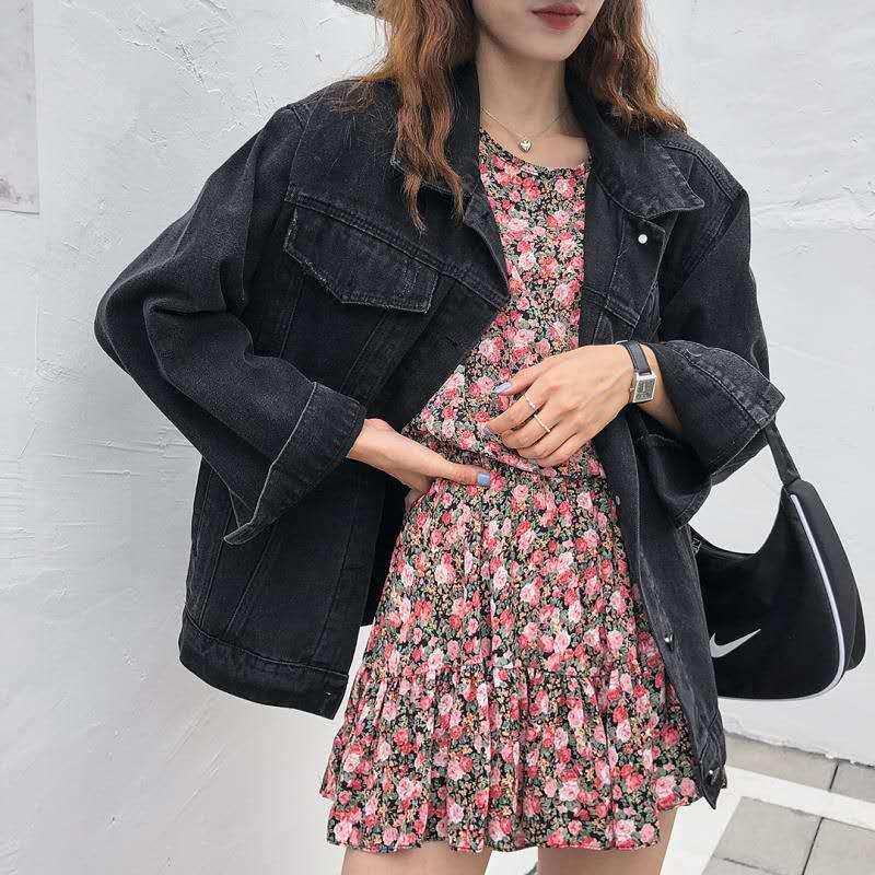 Black loose denim jacket, button-front with point collar; worn over floral dress.
