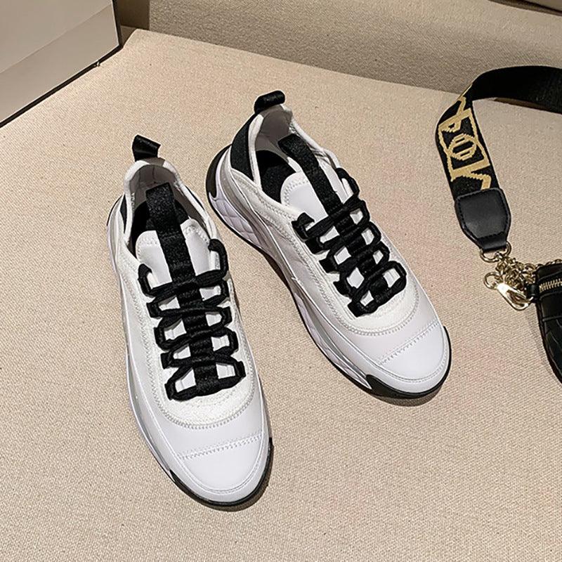 White lace-up chunky wedge sneakers, leather-look upper, black laces, thick sole