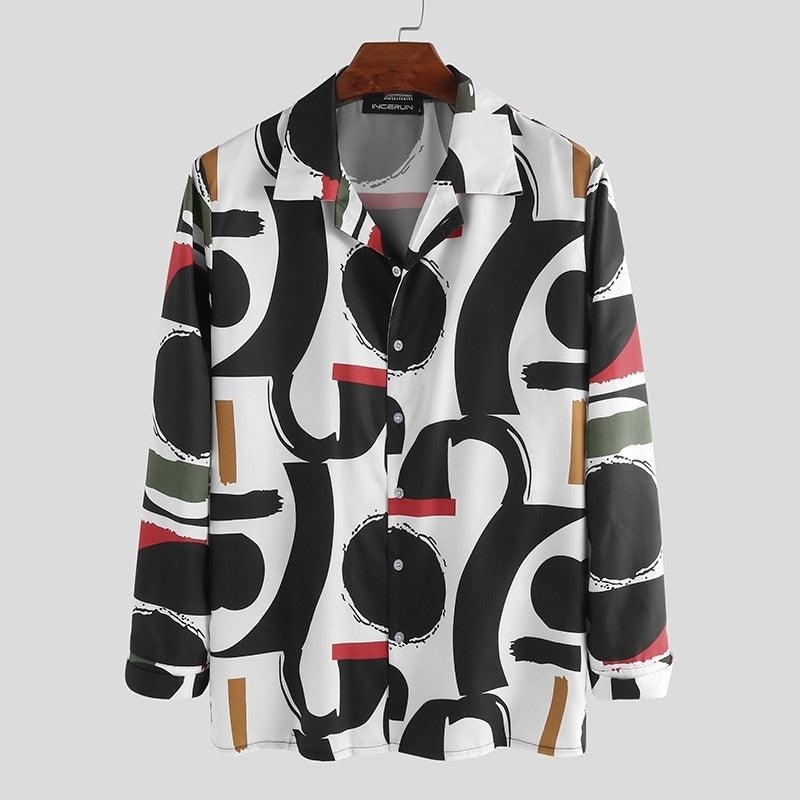 Hanging Hawaiian button-up shirt, black-and-white abstract pattern with tan and red accents.