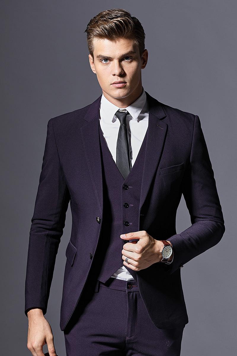 Dark purple men's suit jacket with vest and striped necktie