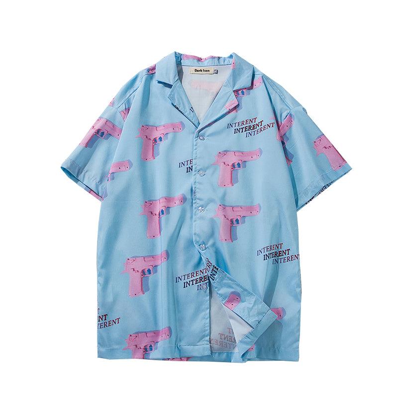 Light blue men's short-sleeve button-up shirt with pink graphic print and camp collar