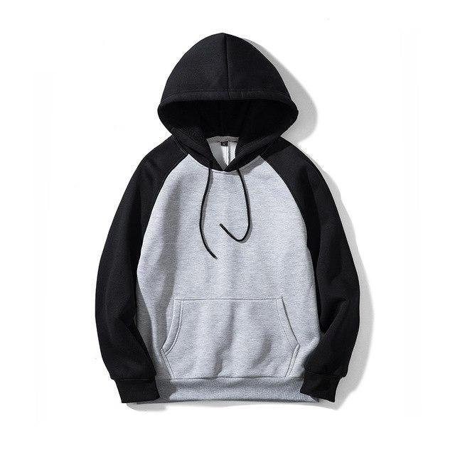 Two-tone hoodie with light gray body and black sleeves; drawstring hood, kangaroo pocket.