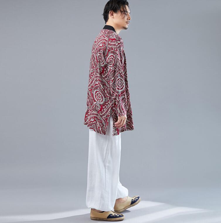 Red patterned thin cardigan with black trim, open front, side view
