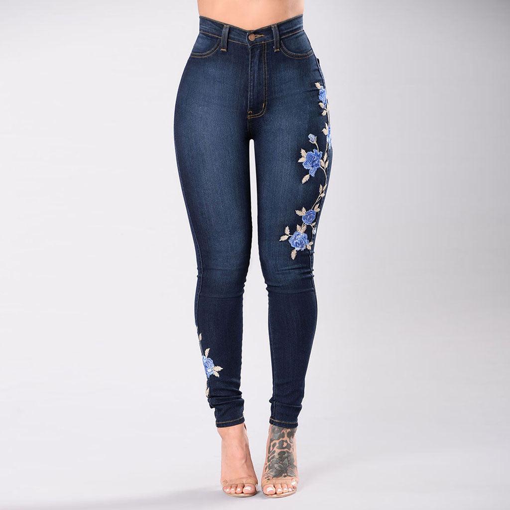 Dark blue skinny jeans with floral embroidery on the right leg