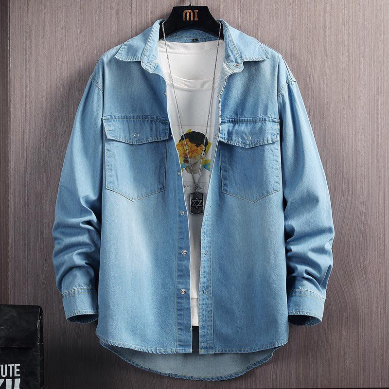 Men's light blue denim button-up shirt with chest pockets and long sleeves.
