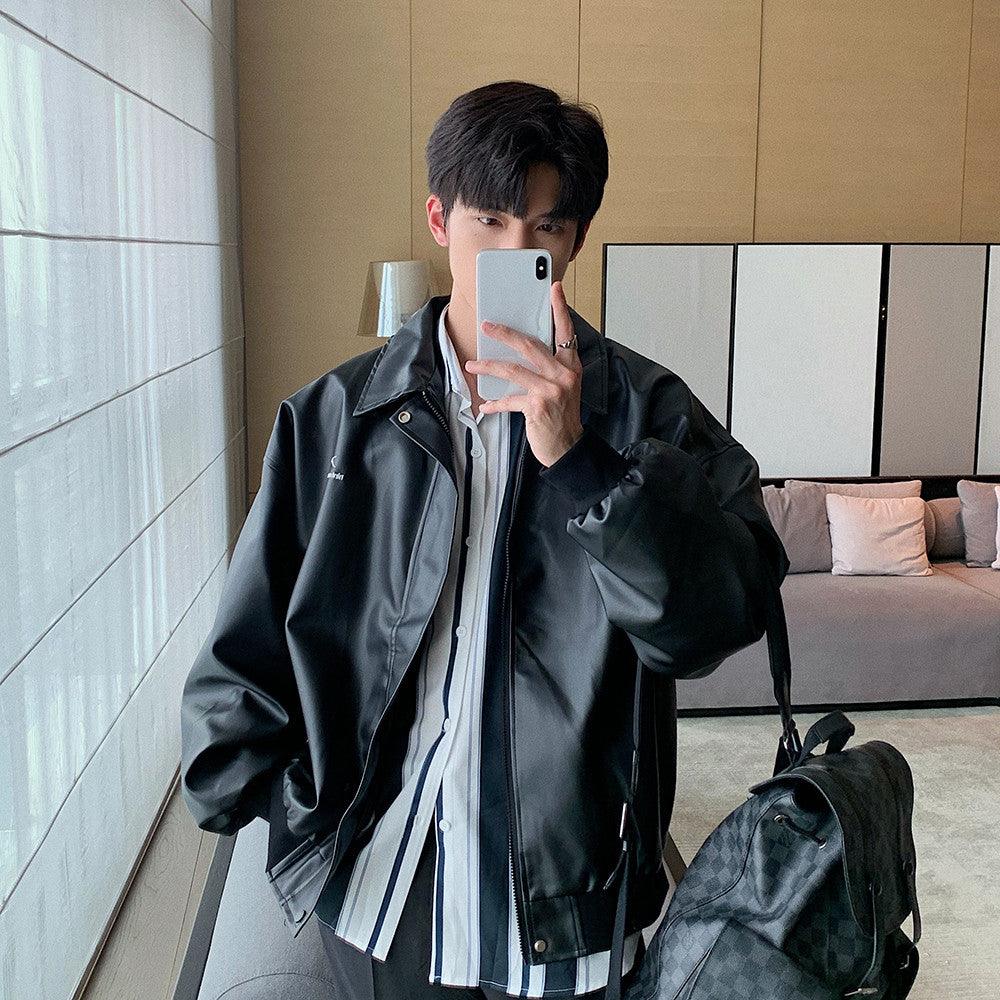Black PU leather lapel jacket with button front and chest logo, long sleeves