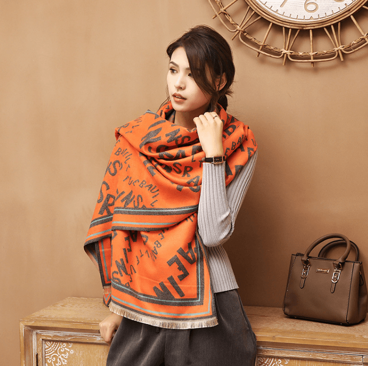 Orange letter jacquard warm scarf with black script pattern and striped edging