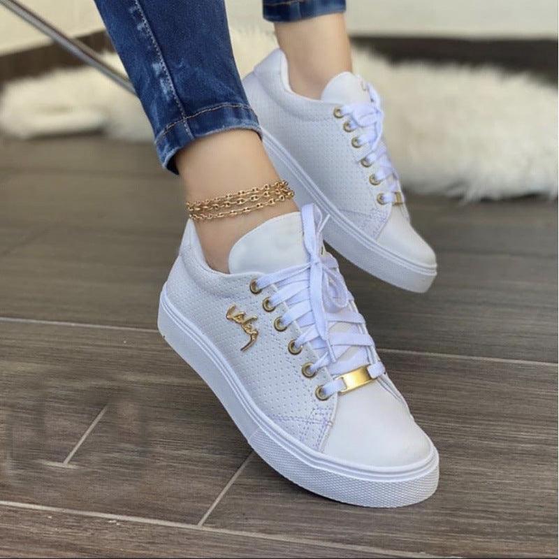 Women's flat lace-up sneakers, white perforated upper with gold emblem and strap