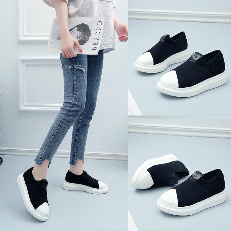 Black slip-on sneakers with white soles, pair shown together, low-cut design