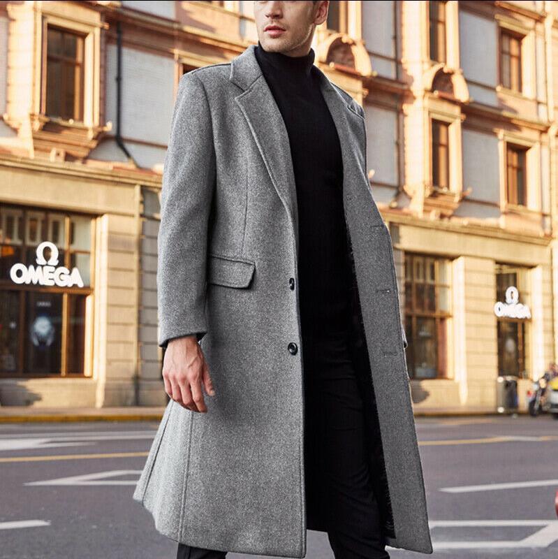 Gray long wool trench coat with notch lapels and buttoned front; side pocket flaps.