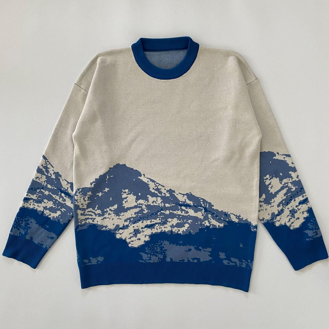 Men's beige mountain sweater with blue ribbed crew neck; blue/cream landscape print