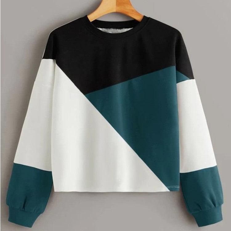 Patchwork round-neck pullover sweater with black, teal and white wide diagonal panel