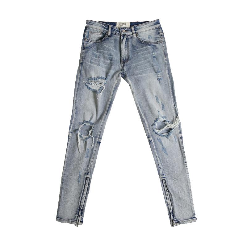 Light blue ripped zipper jeans, studio front view with distressed leg and zipper fly