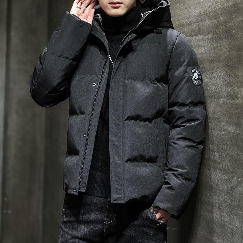 Black puffer work jacket with hood, zip-front, and chest patch