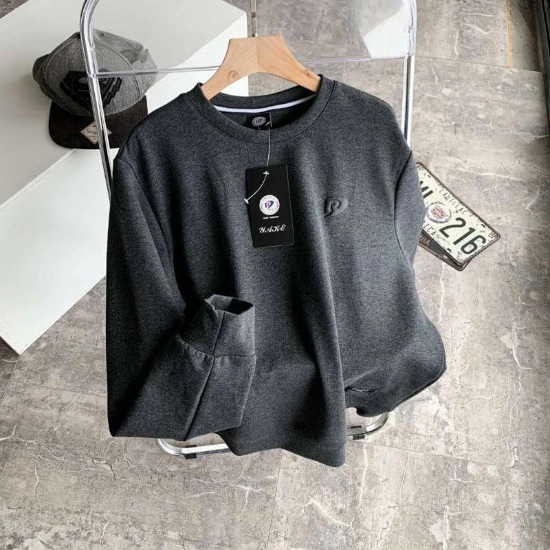 Dark gray long-sleeve pullover base shirt with crew neck and kangaroo pocket; logo tag.