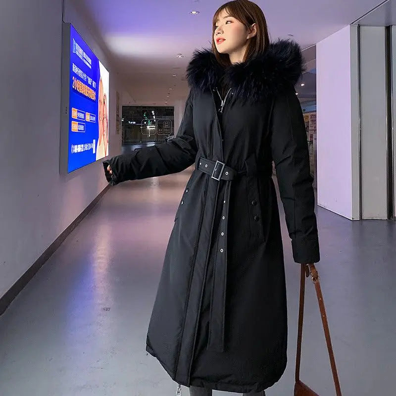 Black over-the-knee slim padded jacket with fur-trimmed hood and belted waist