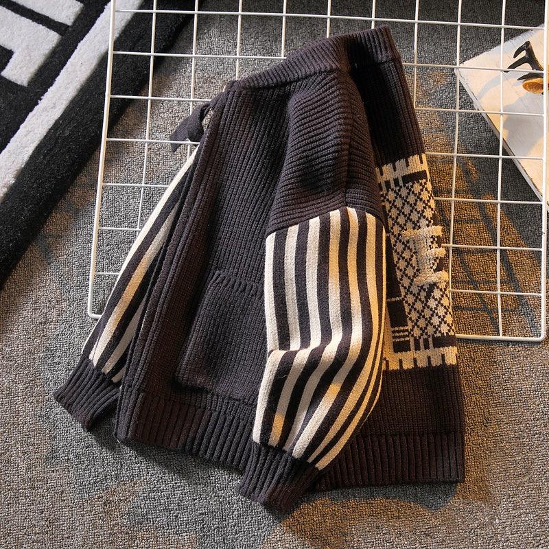 Boys dark grey knit cardigan sweater with striped sleeve cuffs and geometric back detail
