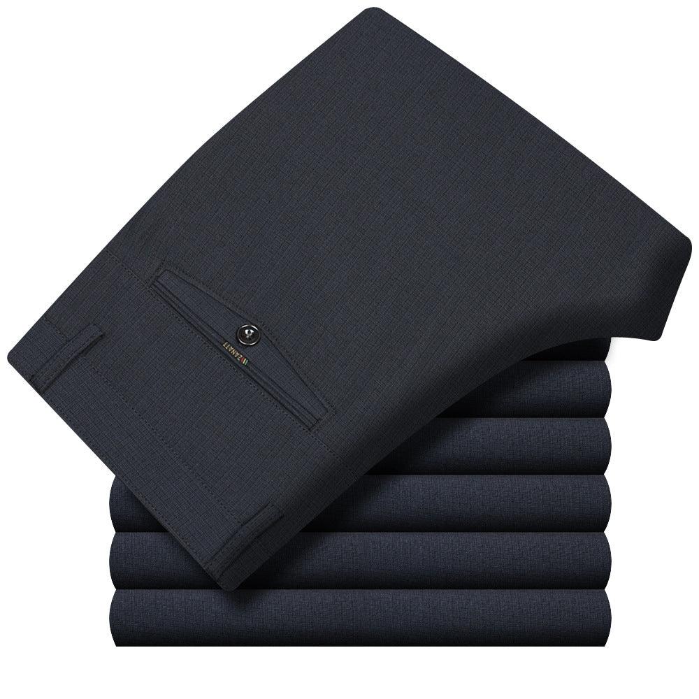 Folded dark dress fabric swatches stack in muted navy tone