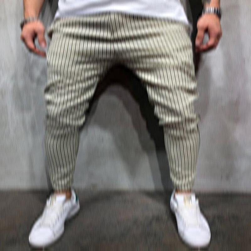 Striped jogger jeans in light olive and white, tapered leg with ankle cuffs