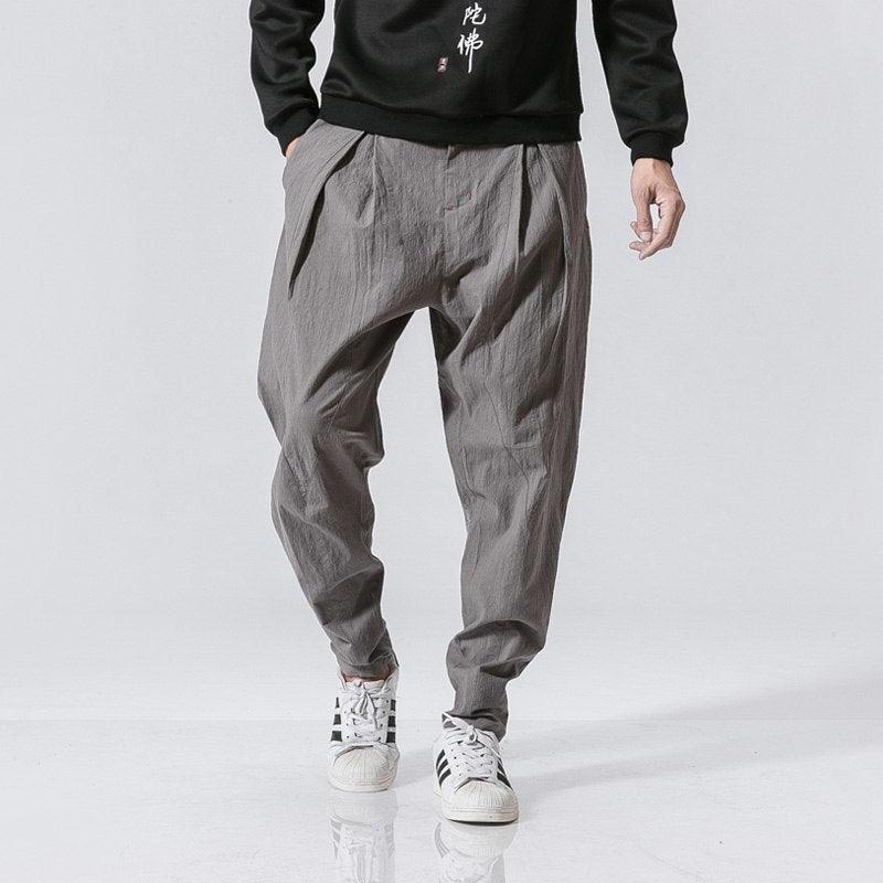 Gray cotton-linen harem pants with elastic waist and relaxed tapered legs