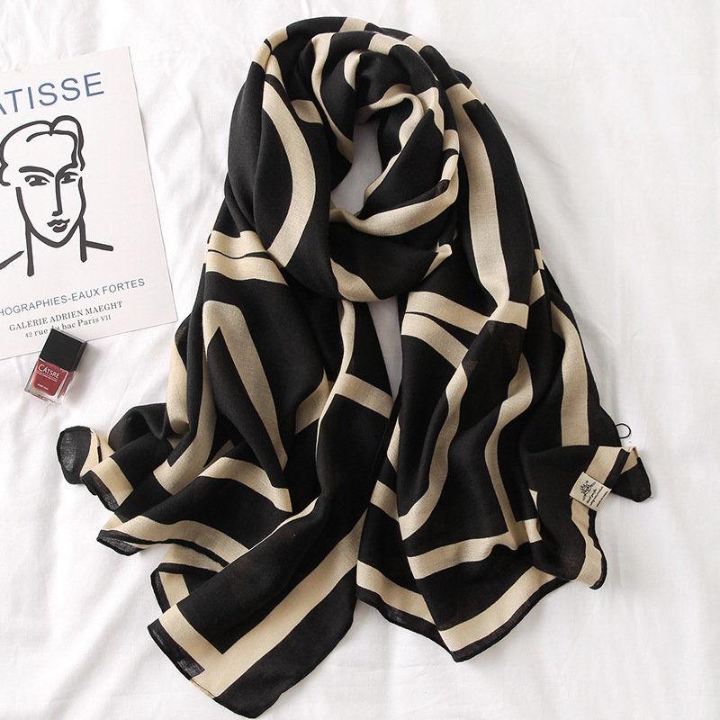 Silk scarf with black base and cream striped waves pattern, soft drape