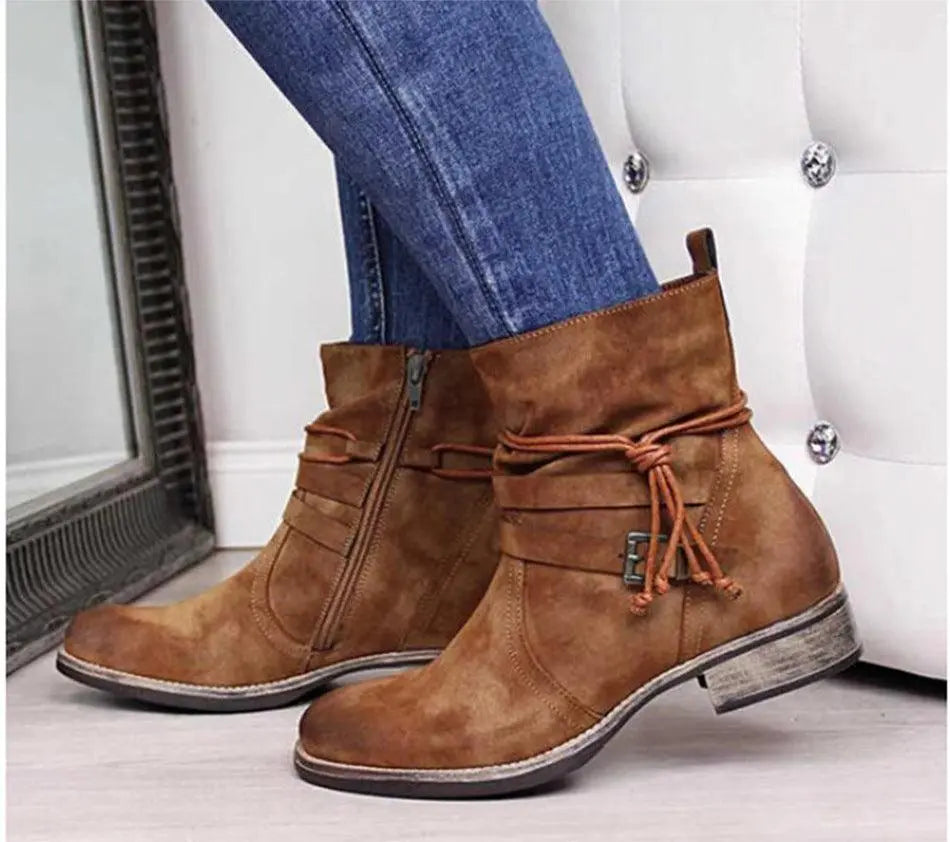 Brown suede short boots with side zip, lace-up detail, and block heel
