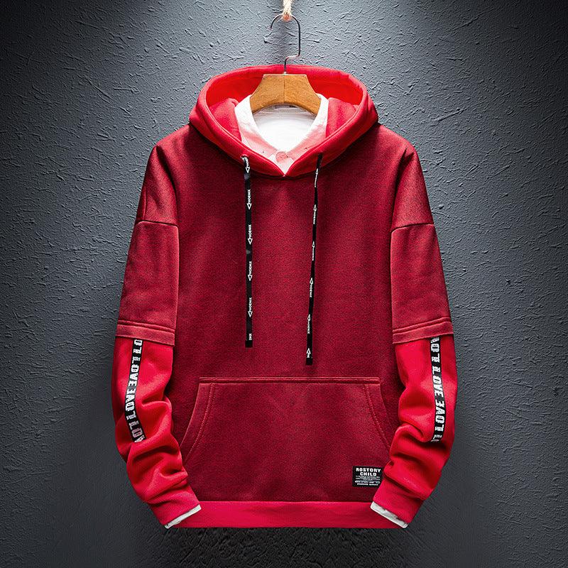 Boys red pullover hoodie with black drawstring hood, kangaroo pocket, and printed sleeve detail