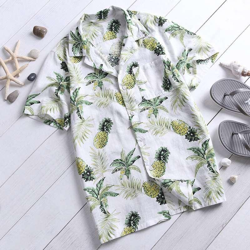 Men's tropical print short-sleeve button-up shirt in white with green pineapple and leaf print