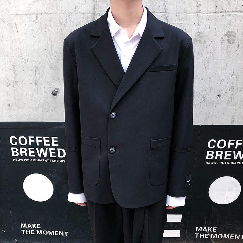 Men's casual suit in dark navy/black: notched-lapel blazer with vest and trousers.