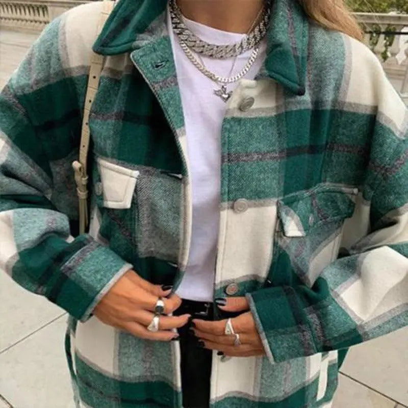 Front-facing plaid wool jacket in green and cream with button closure, long sleeves, chest pocket