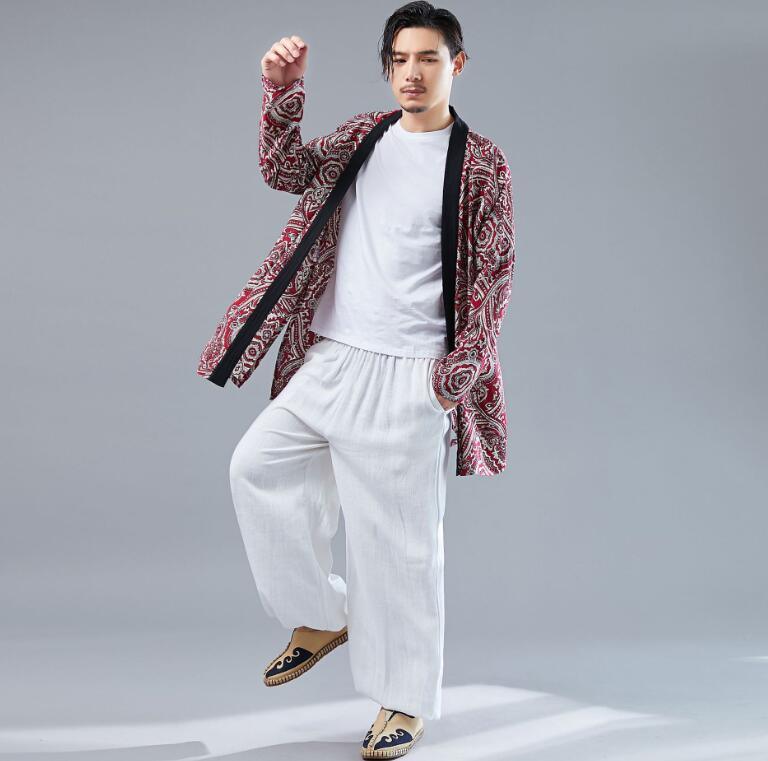 Red paisley thin cardigan with black trim, open front and long sleeves