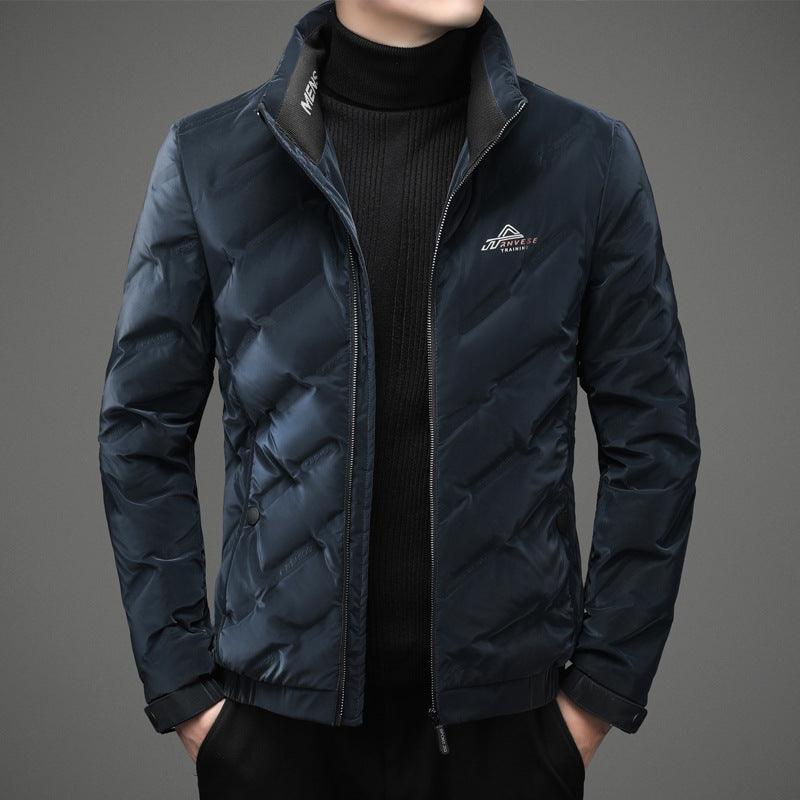 Youth down jacket in navy blue with zip-up front and stand collar.