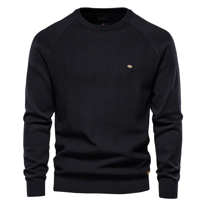 Men’s raglan sleeve sweater in black with textured knit and ribbed crew neck