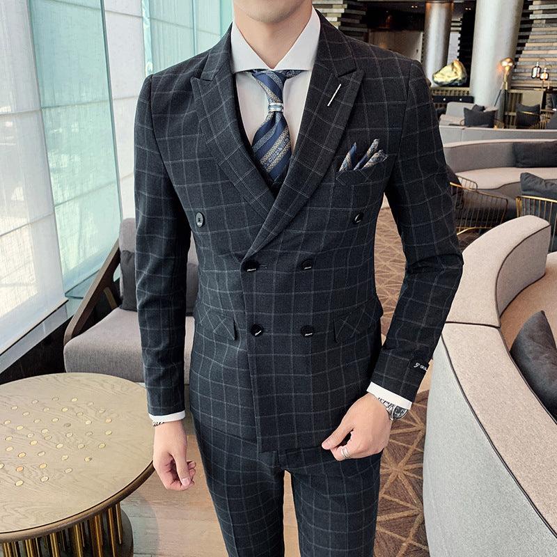 Dark gray plaid three-piece suit with double-breasted blazer and vest, matching trousers