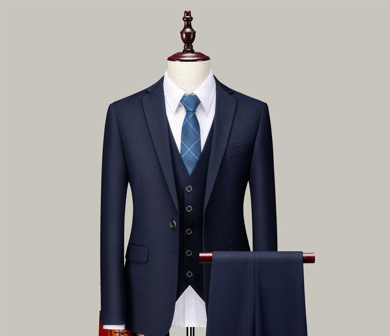 Three-piece suit set in navy with waistcoat, striped blue tie, pocket square, and matching trousers