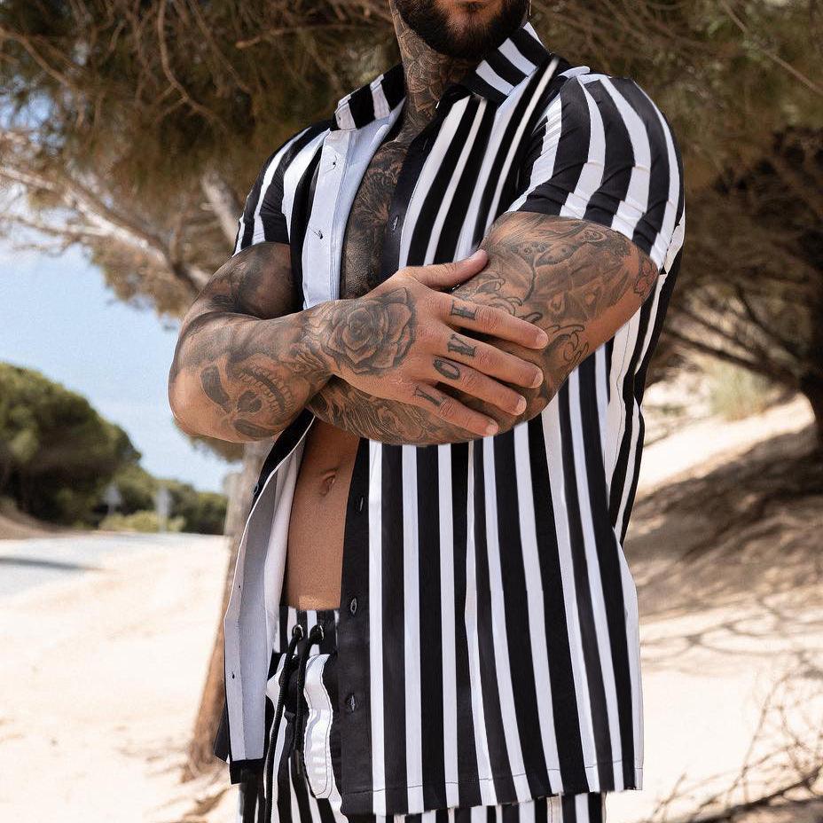 Men's black and white vertical striped short-sleeve button-up shirt, open collar
