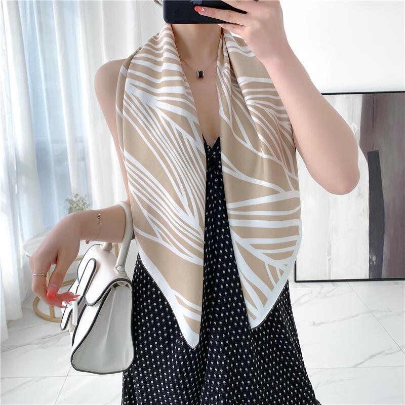 Beige and white twill scarf with bold abstract fan pattern edges