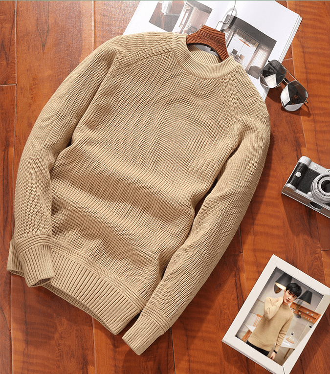 Men's crew-neck sweater in beige knit, ribbed cuffs and hem, laid flat.