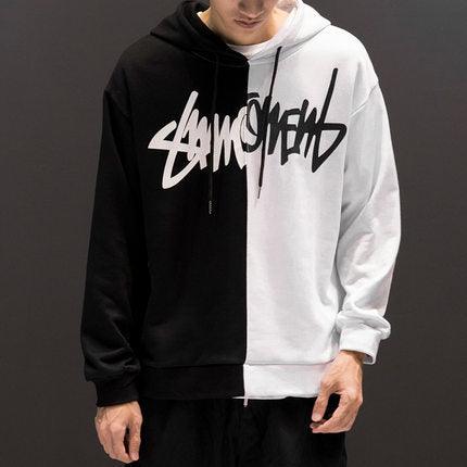 Black and white color-block hooded sweatshirt with front graphic logo and drawstring hood