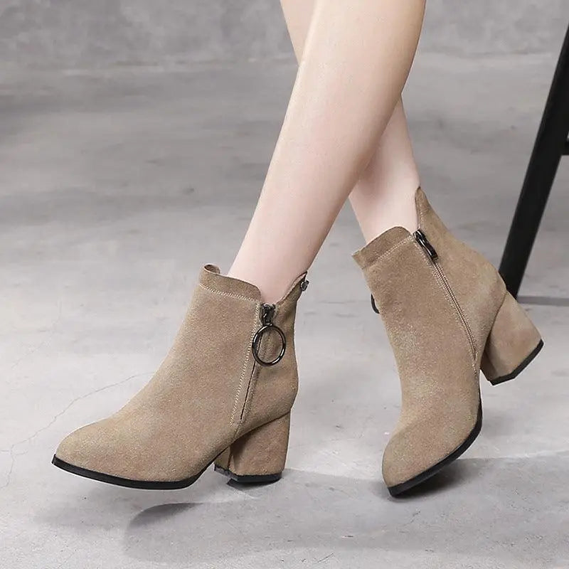Beige suede leather ankle boots with block heel and side zip, metal ring detail