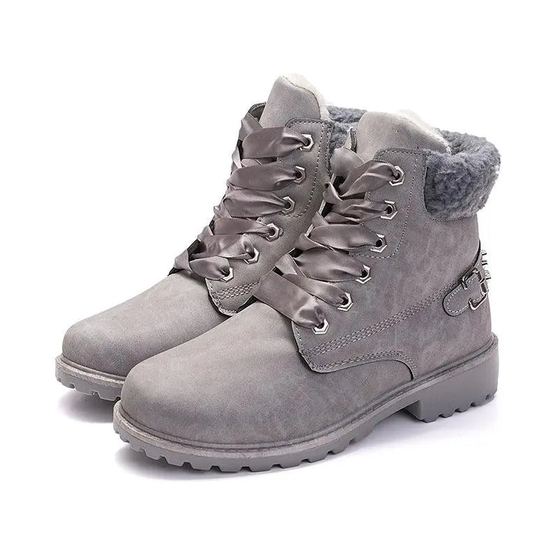 Grey lace-up snow boots with faux-fur cuff and side buckle strap, chunky tread sole