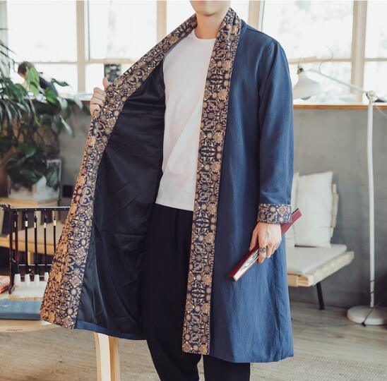 Blue linen cloak with open front, patterned trim along edges and cuffs, knee-length