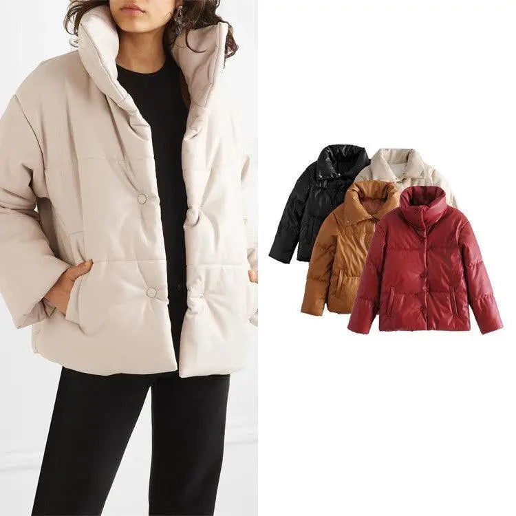 Cream winter puffer jacket with hood, snap buttons, and two side pockets.