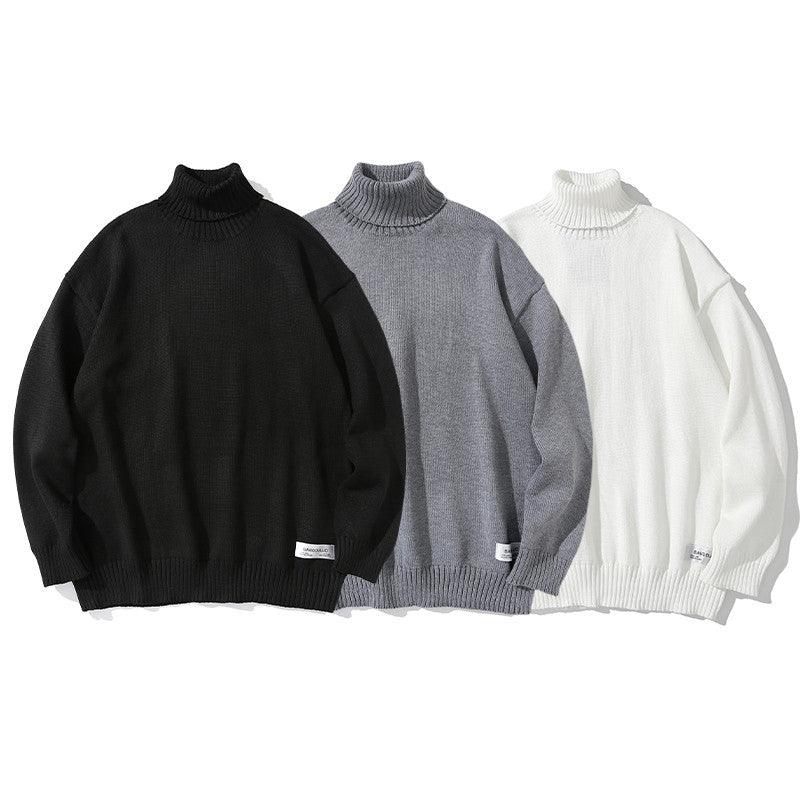 Set of men's crew neck sweaters in black, grey, and white with ribbed cuffs