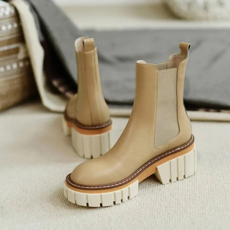 Tan Chelsea ankle boots with elastic side panels and chunky white platform sole
