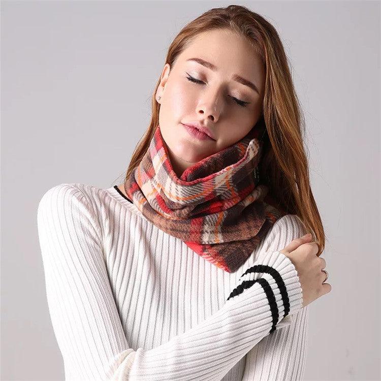 Plaid scarf headrest in red, brown, and white with travel tag